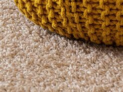 Beige Carpet with ocher knit ottoman- Families Advocating for Chemical & Toxics Safety 