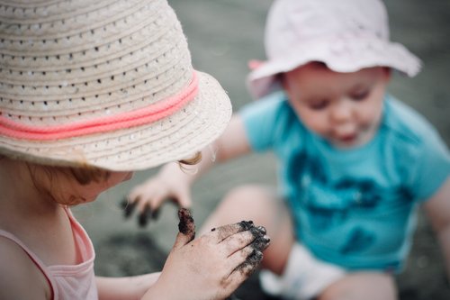 Toddlers playing in mud- Families Advocating for Chemical & Toxics Safety