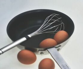 Teflon pan with whisk and eggs- Families Advocating for Chemical & Toxics Safety